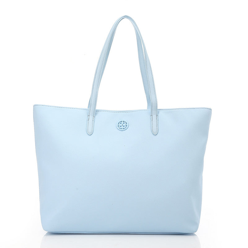 Light blue tote bag with a brand logo on a white background